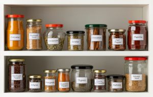Recycled,Glass,Jars,With,A,Variety,Of,Dried,Herbs,In